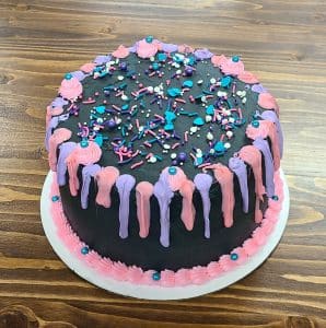 pink purple black custom cake