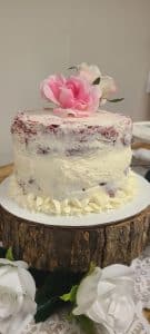 red velvet wedding cake with silk flowers