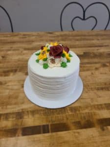 white wedding cake with icing flowers